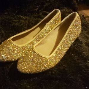 Pair gold shoes